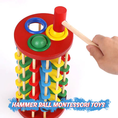 Wooden pounding tower toy with hammer and rolling balls


